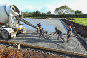 Concrete with Radforce is placed into forms for a large outdoor slab