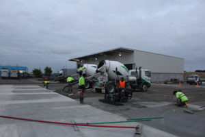 The next stage of a large outdoor concrete slab with Permaforce is poured