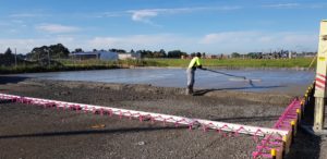 Fibre reinforced concrete is floated by a skilled placer in New Zealand